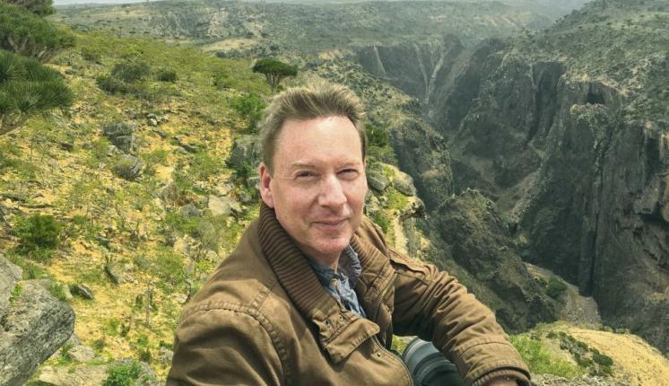 Frank Gardner at the top of a large gorge